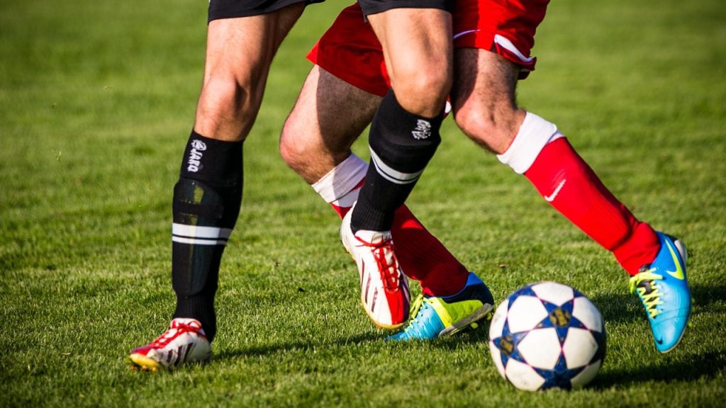Arsenal and AC Milan players competing in a friendly match in Singapore 2025