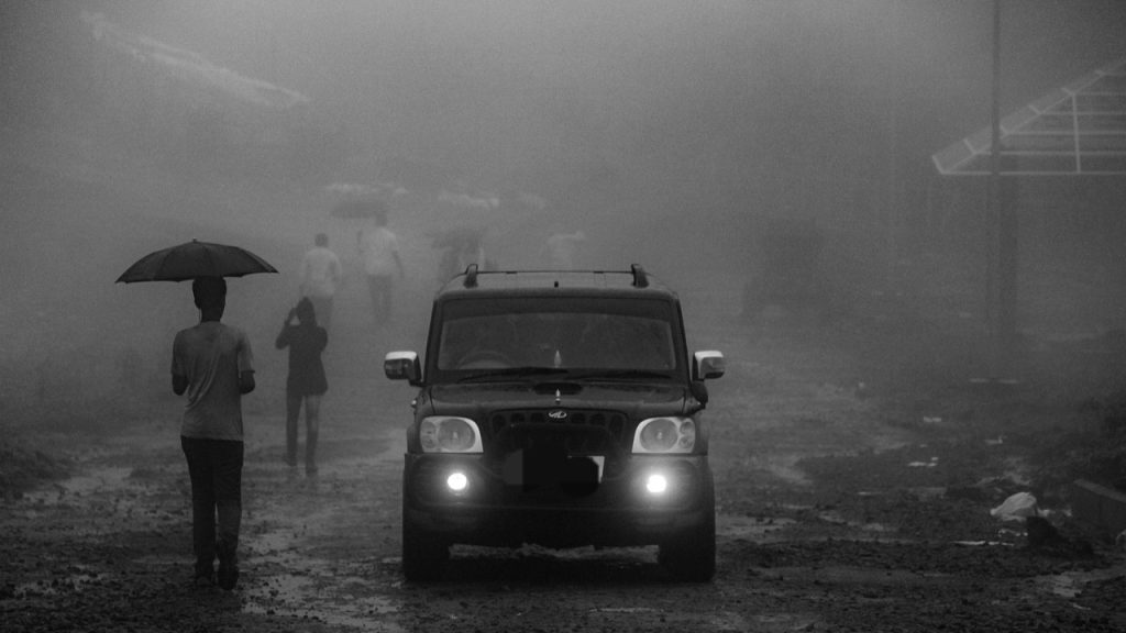 Man wearing a face mask in dusty weather during UAE weather alert