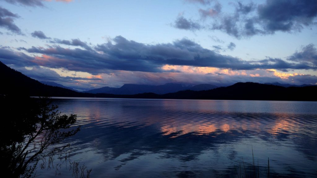 Rara Lake turquoise water in Himalayan surroundings 